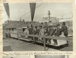 [Mayor Rolph and his "official family" riding a tractor-powered train]