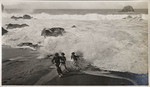 Boys playing in the breakers