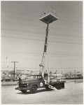 [Exterior detail view utility truck with extended hydralic lift Newbery Electric Corporation, at Al Asher & Sons, 5301 Valley Blvd.]