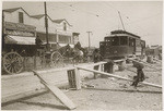 [Streetcar used as tow-truck]