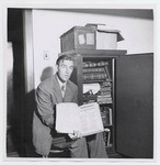 [Richard Dillon holding Shakespeare First Folio]