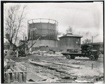 Wilkins Draying Co. hauling concrete piles for California Packing Corporation building, using portable derrick to load