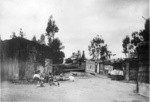 [Refugee children among makeshift shelters]