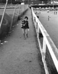 [Boy walking at Santa Monica]