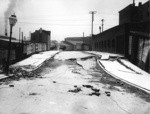 [Subsidence of street and sidewalk. Dore St.]