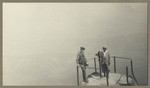 [Two men stand at Mt. Tamalpais peak]