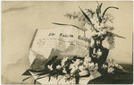 [Flowers in vase next to Folsom Telegraph newspaper]