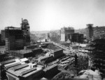 [Cityscape during reconstruction, looking northwest from above circa Third and Howard Sts. Humboldt Building, left; intersection of Market, Grant and O'Farrell Sts., right center]