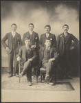 [Studio portrait of six unidentified men]