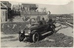 [Auto and house on sand dunes]