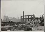 [Makeshift refugee shelters among ruins. Unidentified location. Tower of Ferry Building in distance, left center]