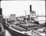 [Barges and steamboats on the Sacramento River]