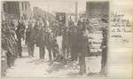 Refugees waiting in line at the bread wagon.