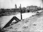 [Buckled curbstone. Harriet St. near Folsom? City Hall (left center) and U.S. Post Office (right center) in distance]