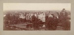 [View of multi-story residences along street]