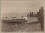 Boat and natives with food captured by Gunboat Manila, and landed at our camp, with crew from Manila.