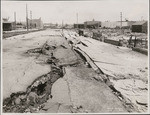 [Subsidence of street and sidewalk along Capp St.]