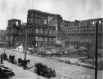 [Ruins along Fifth St. just south of Market. Lincoln School, left; top of Flood Building in distance, left center; burned lot of Metropolitan Temple, center]