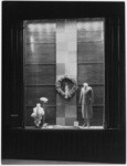 [Exterior night shot display window Bullock's Wilshire building.]