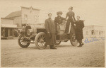 [Men and women posing by car in San Diego Co.]