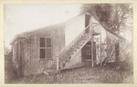 [Half wood, half adobe house]