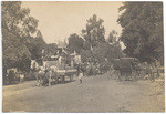 [Parade with horse-drawn carriages] 2 views