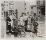 [Group posing at street kitchen. Unidentified location]