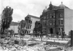 [Tilted houses and ruins along Howard St.]