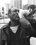 [Man drinking from a bottle]