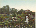 Paul de Longpre and his daughter in his garden at Hollywood, Cal.