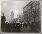 [Crowd on Market Street during fire. Call Building, left center; James Clair Flood Building, right]