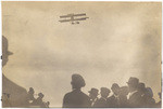 Biplanes flying in unidentified aviation meets, 4 views.