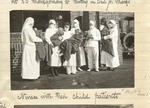 Nurses with their child patients.