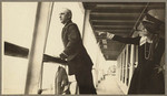 [Ship officer and woman posing on ship's deck, SS Admiral Farragut]