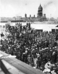 [Crowd gathered at unidentified event. At Van Ness Ave. and Market St. City Hall in distance] (3 views)