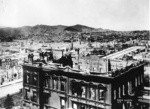 [Panoramic view of city from atop Fairmont Hotel. View looking southwest from Nob Hill. Flood mansion, foreground; Twin Peaks in distance, left center]