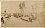 [Street scene showing parade entries]