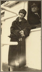 [Woman posing next to ship officer on the SS Admiral Farragut]