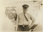 [Man in uniform beside plane]