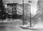 [Ruins and rubble along Commercial St.]