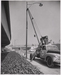 [Exterior general view of utility truck installing street light Newbery Electric Corporation]