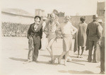 [Clown and two men dressed as women]