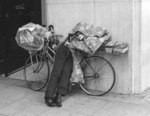 [Sleeping man with bicycle]