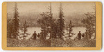 [Man and women on hillside above lake]