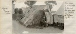 [Young boy outside his refugee shack]