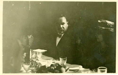 Man seated at dinner table