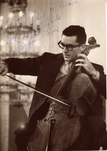 Autographed publicity portrait of Douglas Davis playing the cello