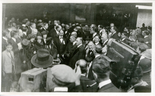 Group of men and women standing and talking