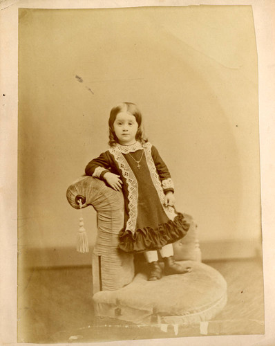 Portrait, unidentified child standing on chair