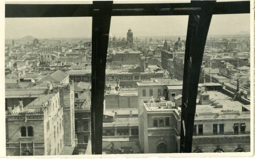 View of rooftops, spires and domes in Mexico City